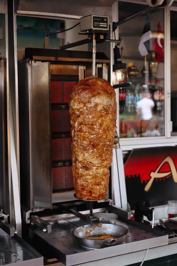 Donair meat roasting on a vertical spit