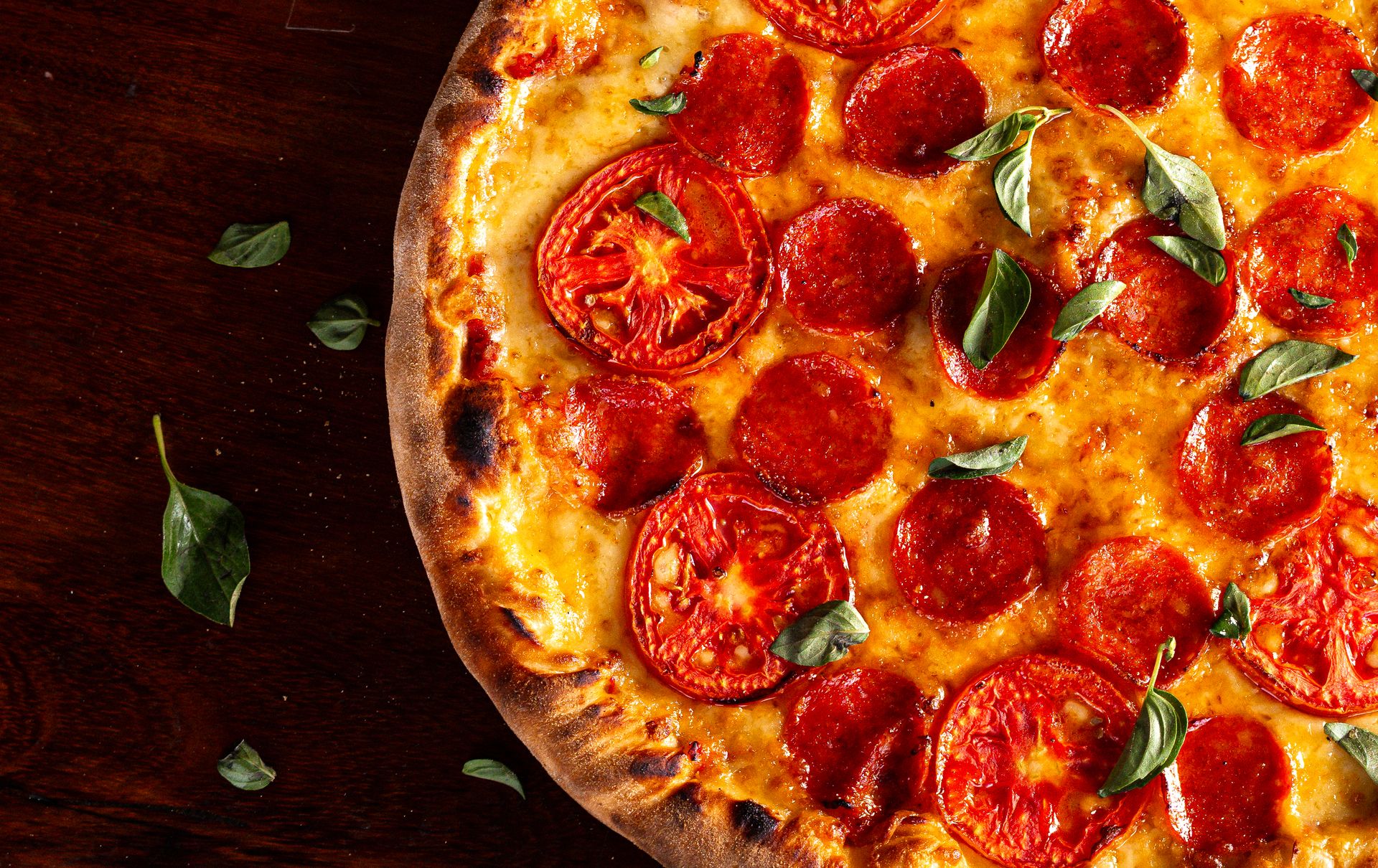 Close-up of a bubbling cheese pizza with pepperoni slices